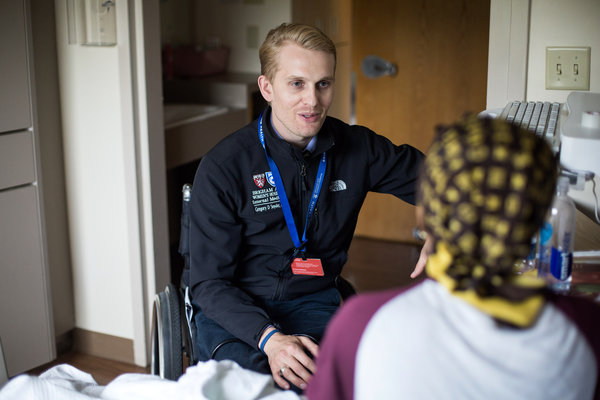 Dr. Gregory Snyder with a patient